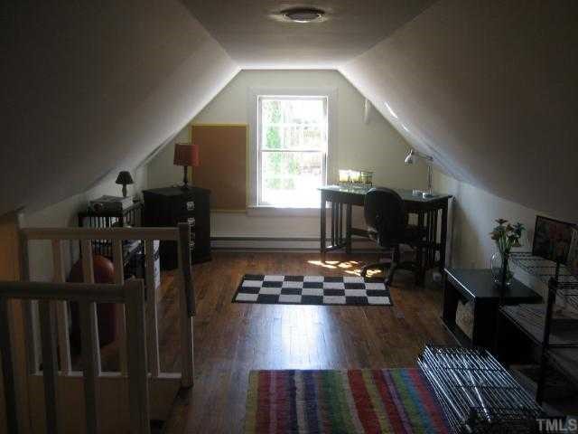 2709 Van Dyke Avenue Raleigh, NC 27607 - Photo 9 of 11 a living room with lots of furniture and a wooden floor