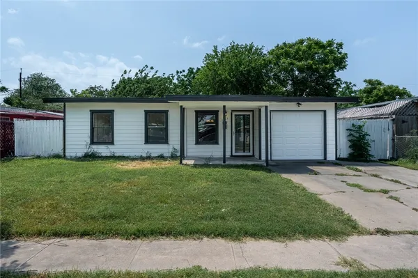 front view of house with a yard