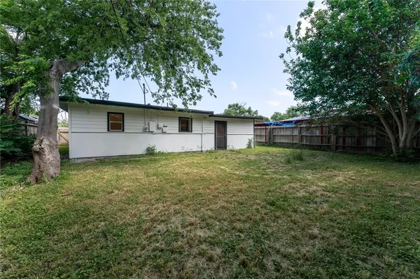 a backyard of a house with lots of green space