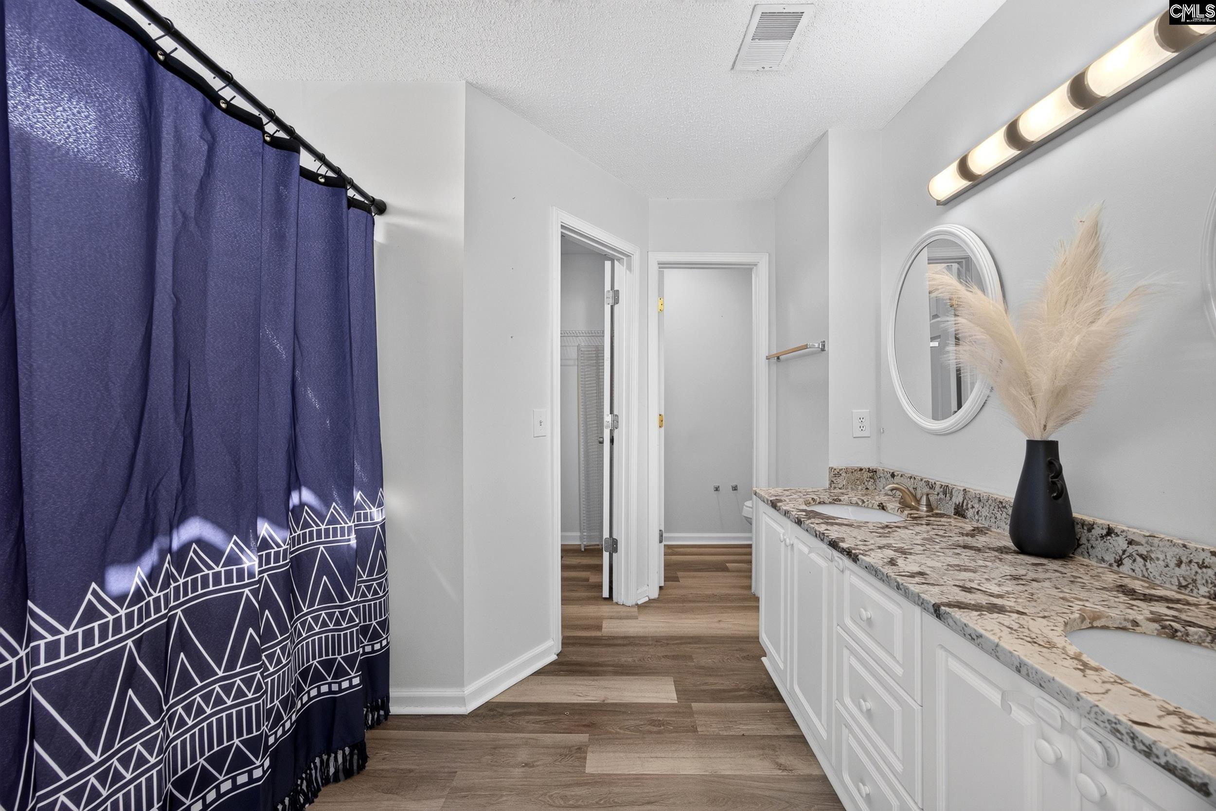 407 Sesqui Trail Columbia, SC 29223 - Photo 24 of 34 a spacious bathroom with a double vanity sink and a mirror