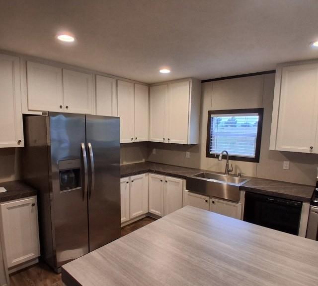 798 North 4190 Road Hugo, OK 74743 - Photo 6 of 16 a kitchen with stainless steel appliances granite countertop a refrigerator a sink a stove a microwave and island