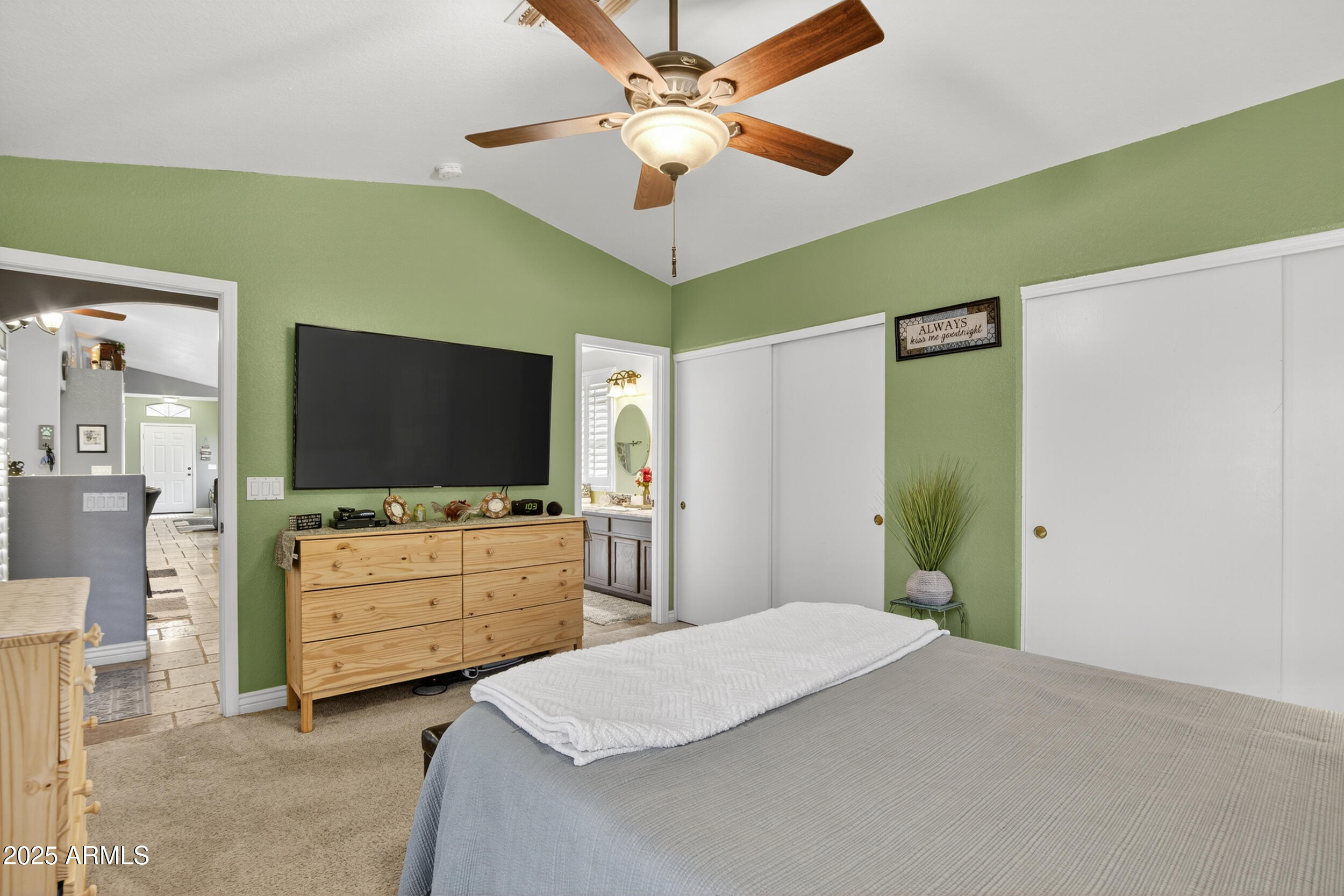 3930 East Agave Road Phoenix, AZ 85044 - Photo 24 of 44 a bedroom with a bed and a flat screen tv