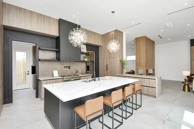 a kitchen with a table and chairs in it