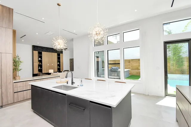 a kitchen with stainless steel appliances granite countertop a stove and a refrigerator