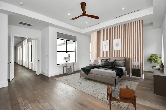 a bedroom with furniture and a window