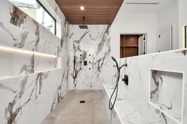 a bathroom with a double vanity sink and mirror