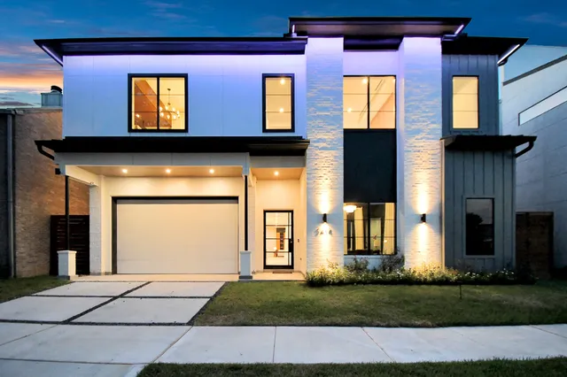 a view of a brick house with many windows