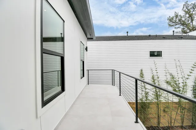 a view of a house with wooden deck