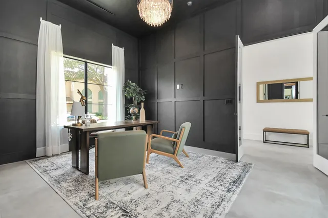 a dining room with furniture and window