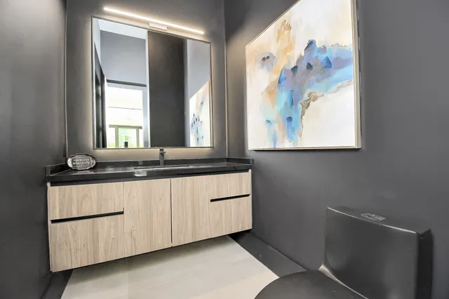 a bathroom with a sink and a mirror