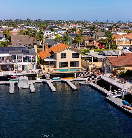 an aerial view of residential houses and outdoor space