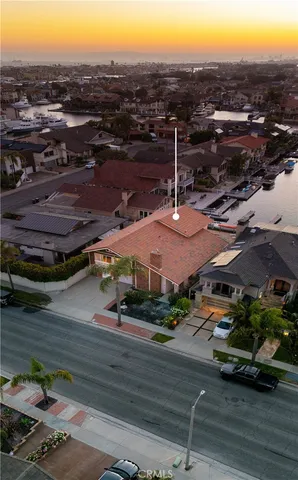 a view of a house with pool and chairs