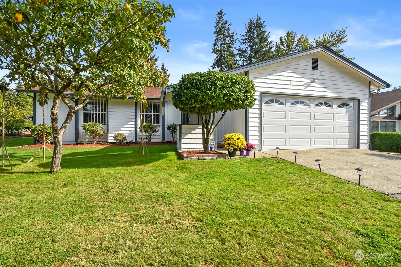 a front view of a house with a yard