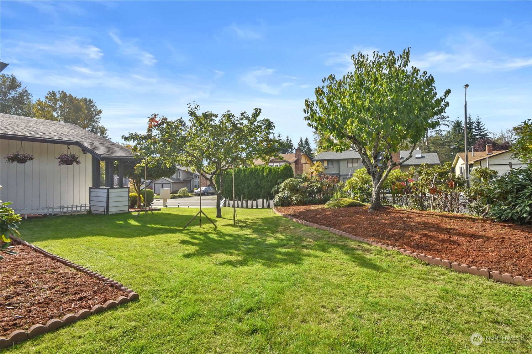 31108 11th Place Southwest Federal Way, WA 98023 - Photo 16 of 22 a backyard of a house with table and chairs