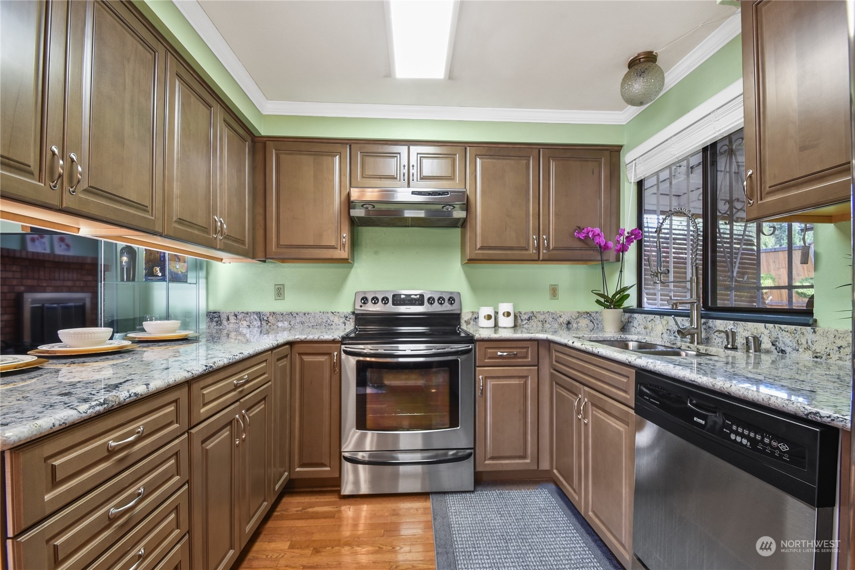 31108 11th Place Southwest Federal Way, WA 98023 - Photo 5 of 22 a kitchen with stainless steel appliances granite countertop a sink stove and cabinets