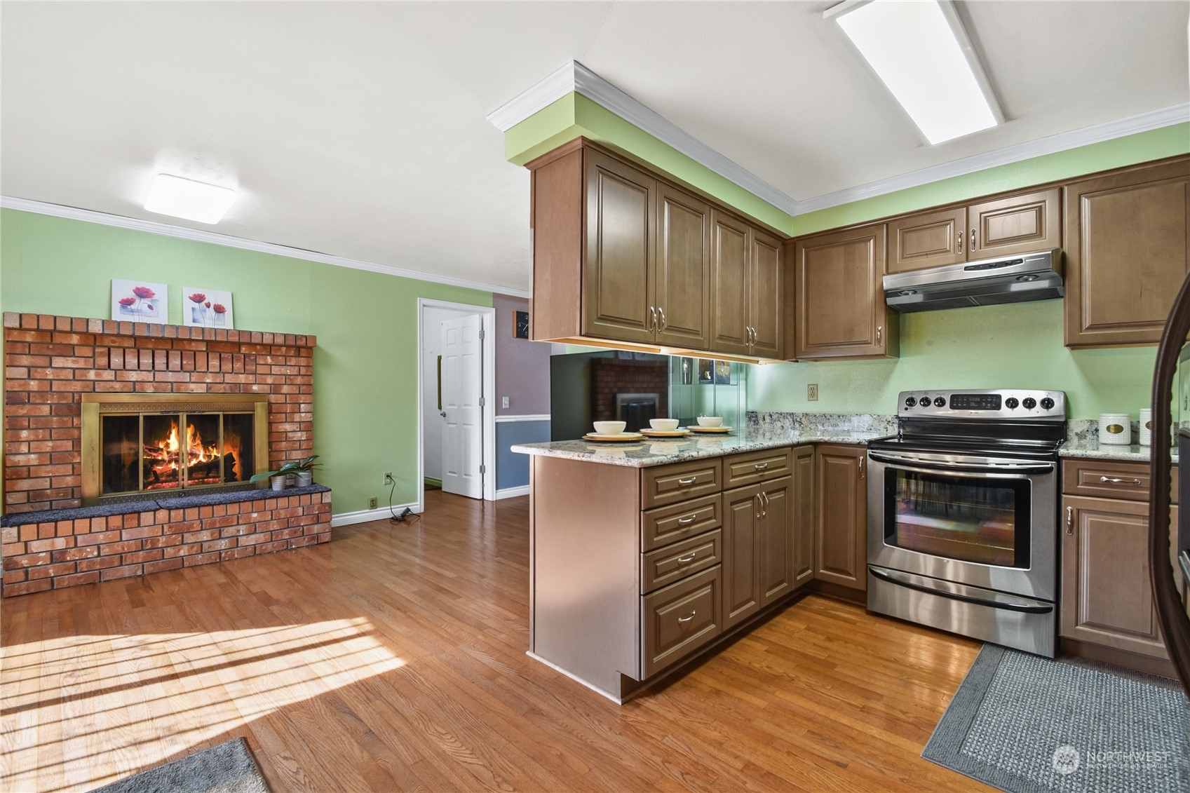 31108 11th Place Southwest Federal Way, WA 98023 - Photo 6 of 22 a kitchen with stainless steel appliances granite countertop a stove a sink and a refrigerator