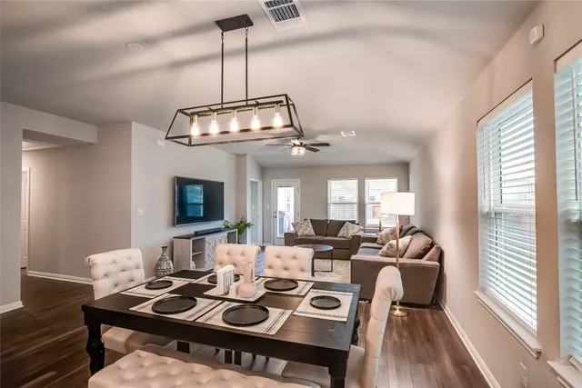 a bedroom with a bed and a flat tv screen