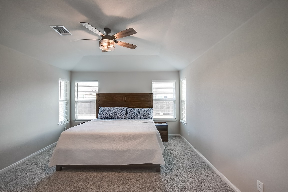 403 Grapefruit Road Hutto, TX 78634 - Photo 17 of 30 a bedroom with a bed and window