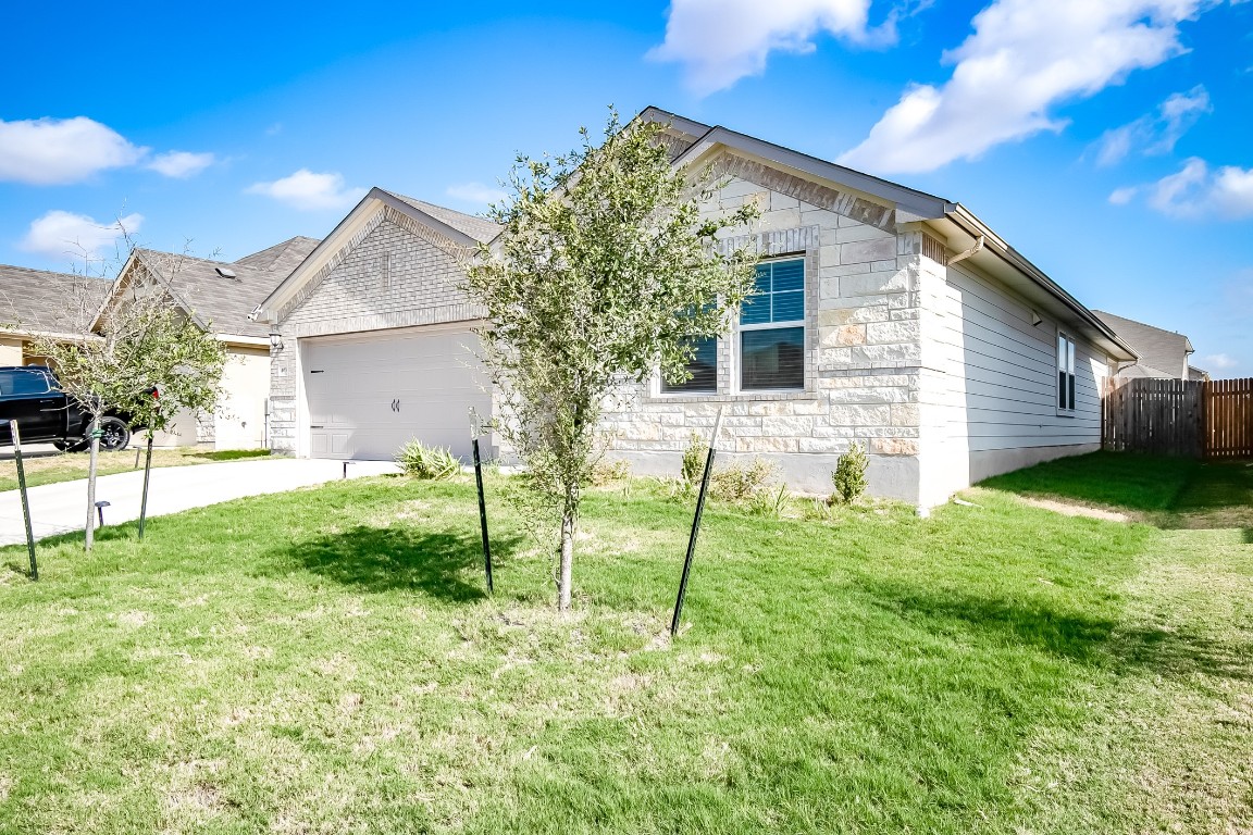 403 Grapefruit Road Hutto, TX 78634 - Photo 2 of 30 a view of backyard of house