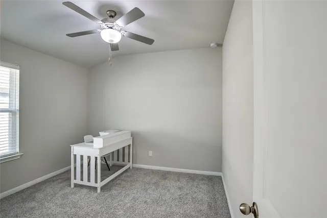 a view of backyard with a barbeque grill and a yard