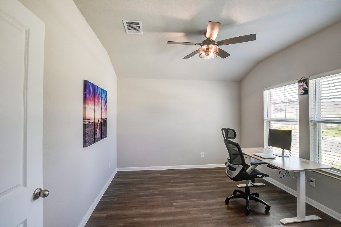 403 Grapefruit Road Hutto, TX 78634 - Photo 4 of 30 a view of a workspace with furniture and a window