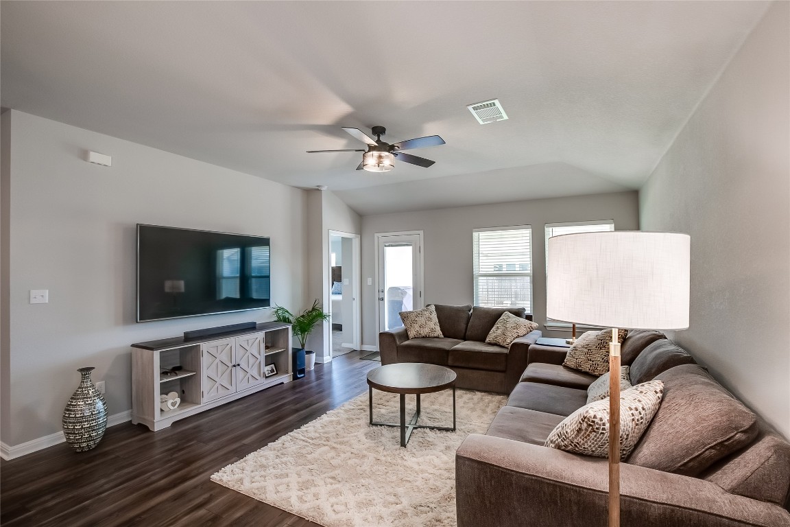 403 Grapefruit Road Hutto, TX 78634 - Photo 7 of 30 a living room with furniture and a flat screen tv