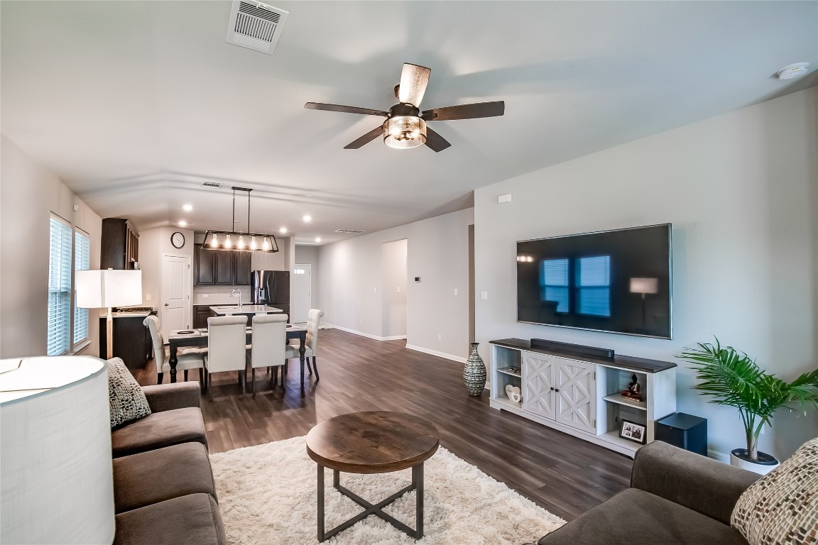 403 Grapefruit Road Hutto, TX 78634 - Photo 9 of 30 a living room with furniture and a flat screen tv