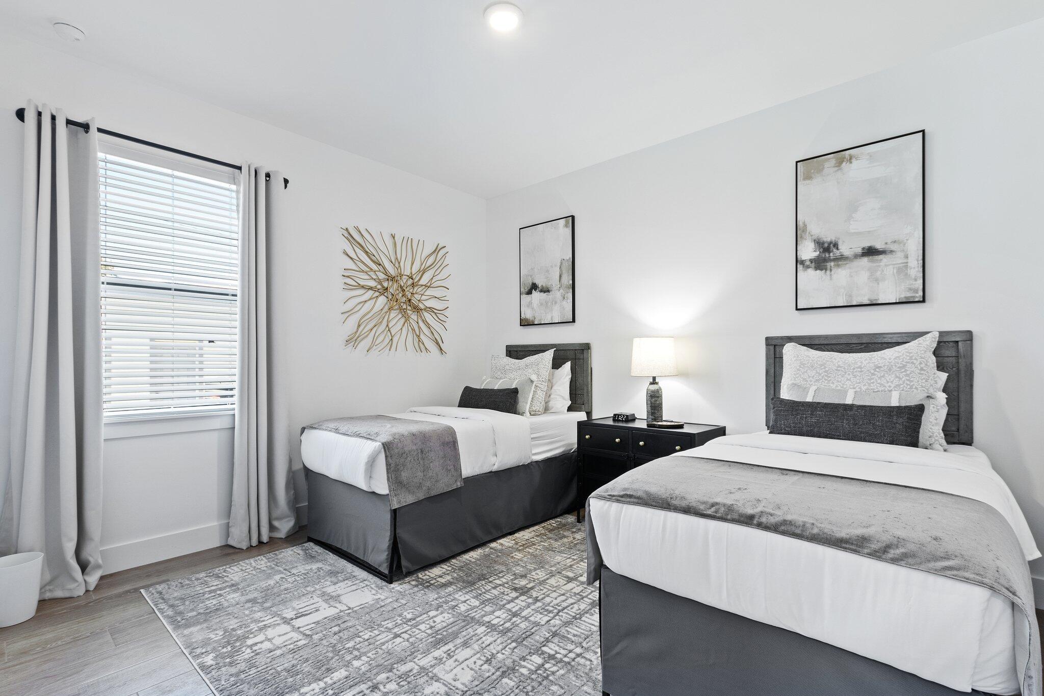 601 Southwest 3rd Street Delray Beach, FL 33444 - Photo 33 of 75 a spacious bedroom with two beds and a window