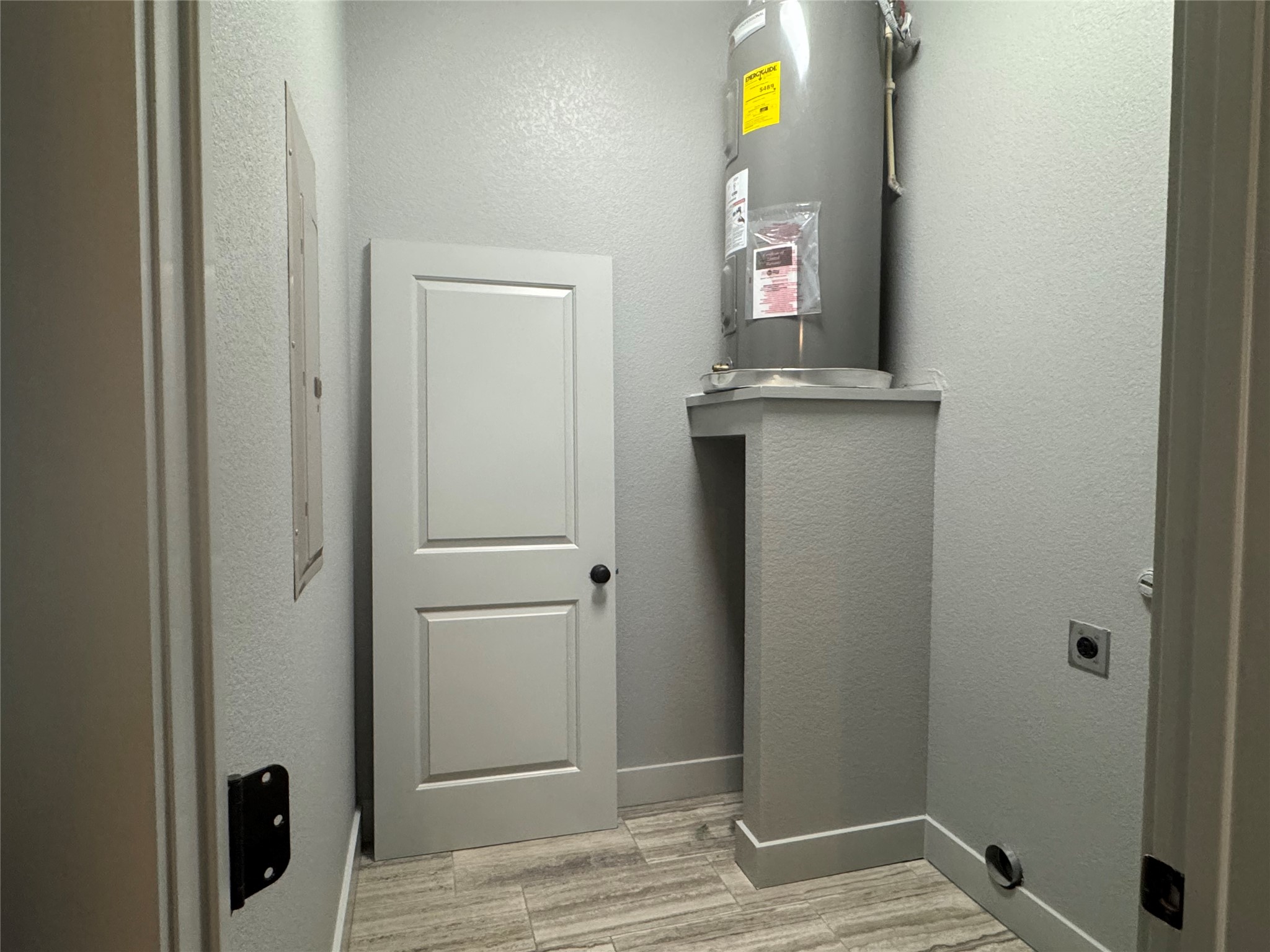 290 Hugo Road, Unit B San Marcos, TX 78666 - Photo 10 of 22 a view of a hallway with wooden floor