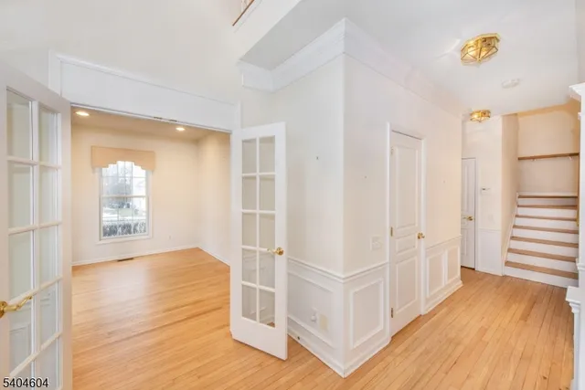 a view of an entryway with wooden floor