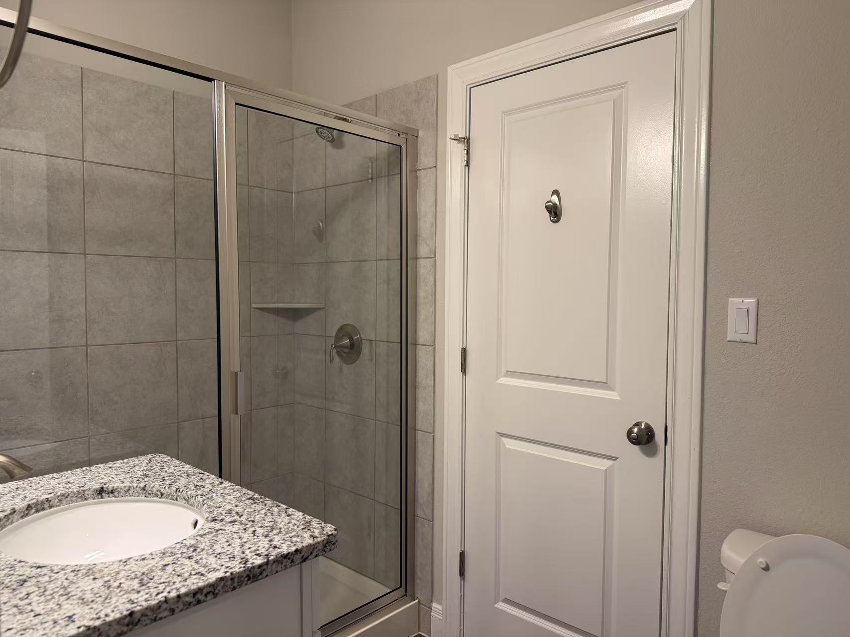 16103 Windroot Street Austin, TX 78728 - Photo 22 of 32 Full bathroom with vanity, a stall shower, and toilet