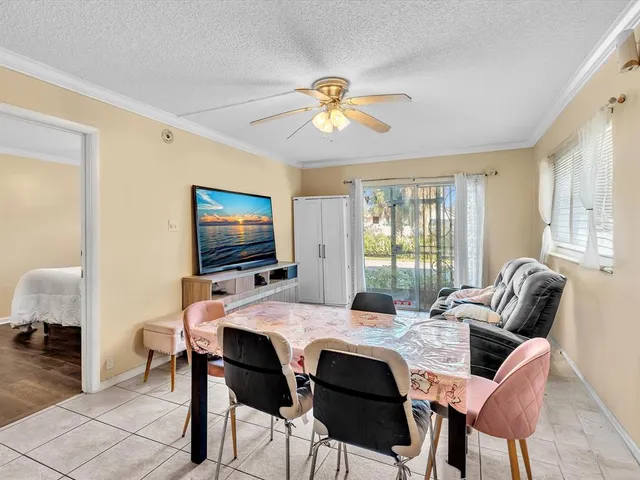 a bedroom with bed and a chandelier