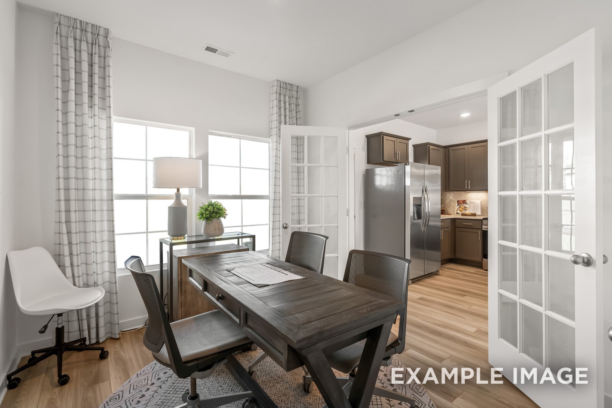 1721 Elliott Williams Way Gallatin, TN 37066 - Photo 13 of 22 a view of a dining room with furniture window and wooden floor