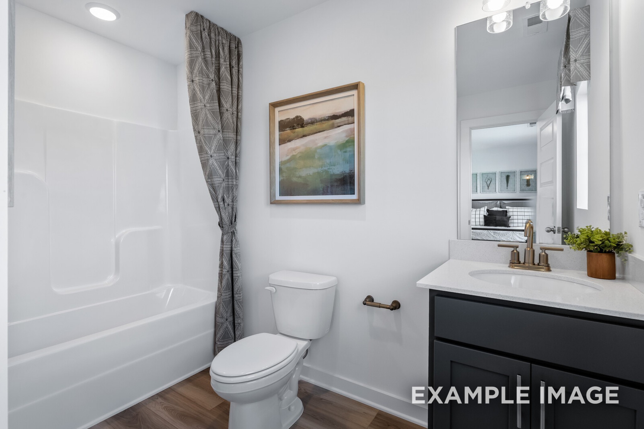 1721 Elliott Williams Way Gallatin, TN 37066 - Photo 20 of 22 a bathroom with a granite countertop sink toilet and shower