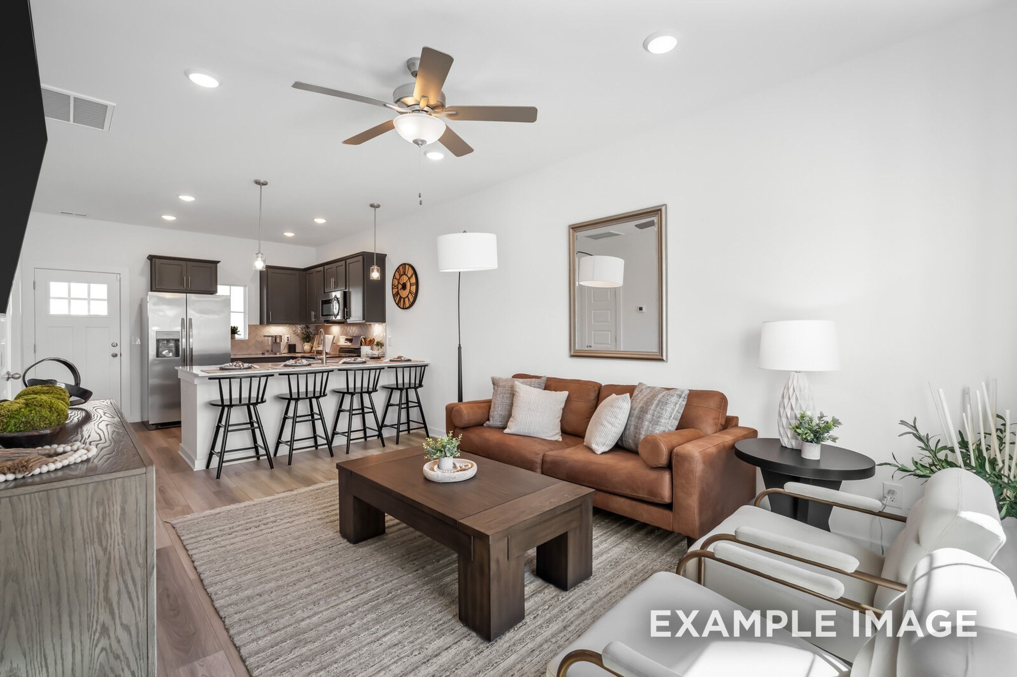 1721 Elliott Williams Way Gallatin, TN 37066 - Photo 7 of 22 a living room with furniture kitchen view and a wooden floor