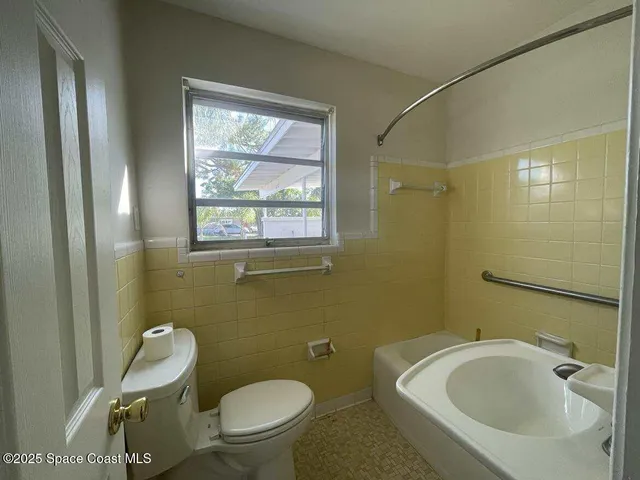 a bathroom with a sink and a toilet