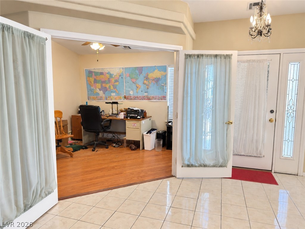 5470 Grain Mill Road Pahrump, NV 89061 - Photo 7 of 80 Double doors open to a private study with warm hardwood flooring.