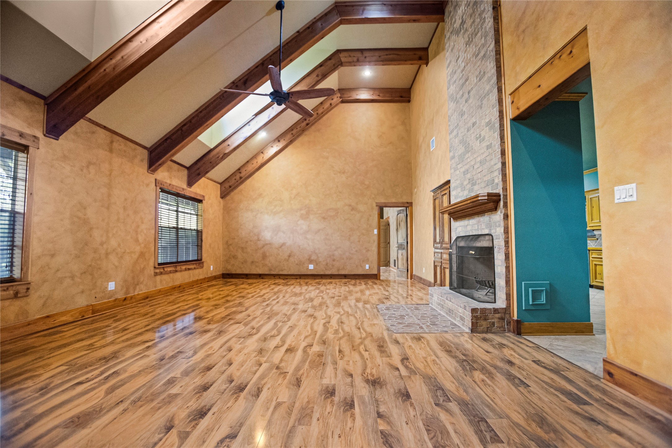 22916 East Martin Drive Porter, TX 77365 - Photo 5 of 43 a view of an empty room with wooden floor and a window