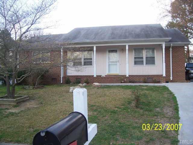 4508 Kilcullen Drive Raleigh, NC 27604 - Photo 1 of 6 a front view of a house with garden