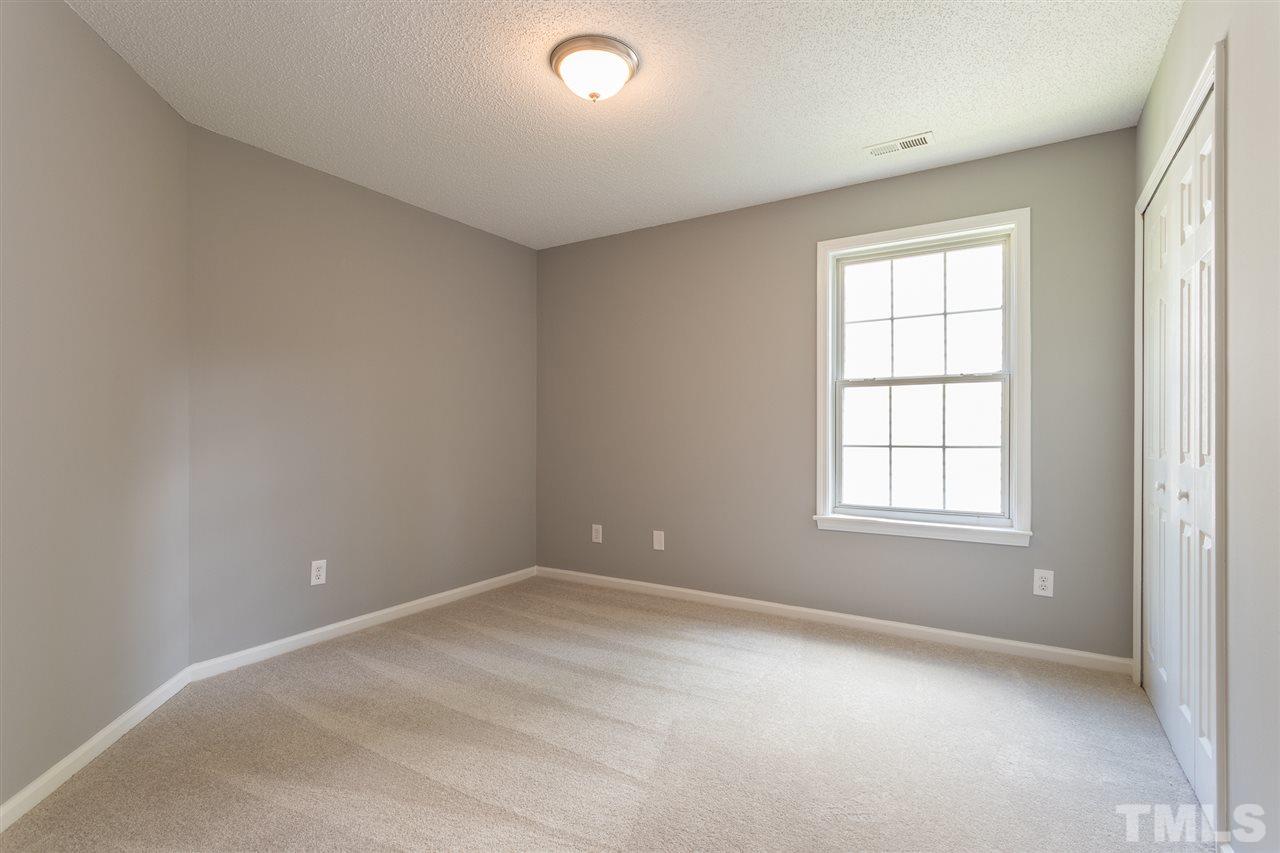 4628 Drewbridge Way Raleigh, NC 27604 - Photo 14 of 21 an empty room with a window