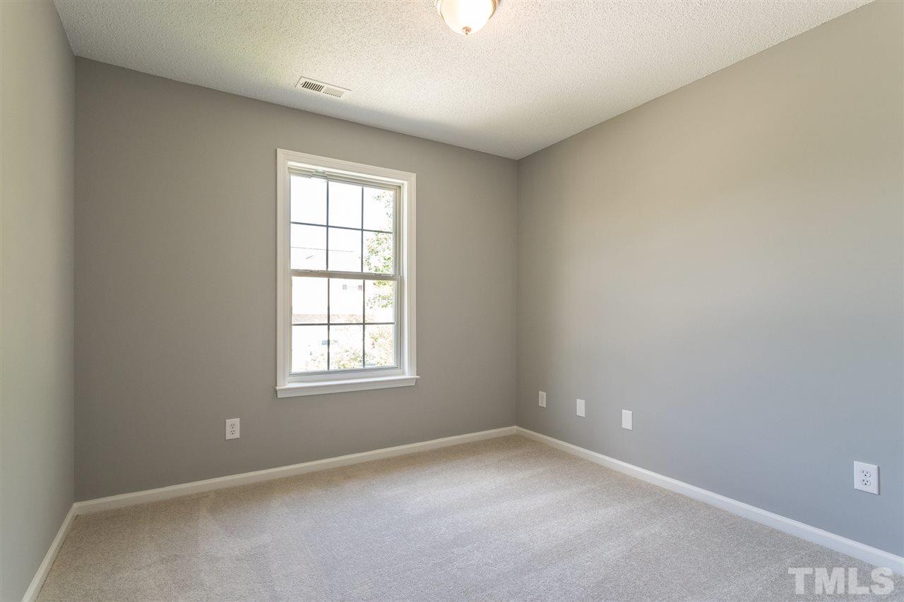 4628 Drewbridge Way Raleigh, NC 27604 - Photo 15 of 21 an empty room with a window