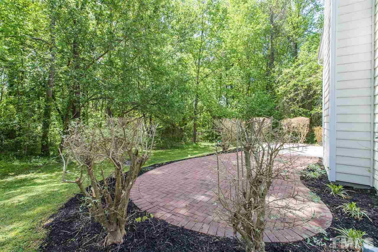 4628 Drewbridge Way Raleigh, NC 27604 - Photo 19 of 21 a view of a backyard with a garden