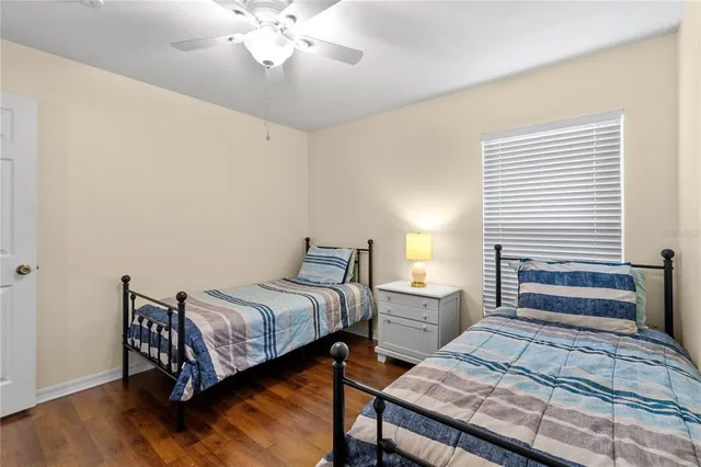 a bedroom with bed and window