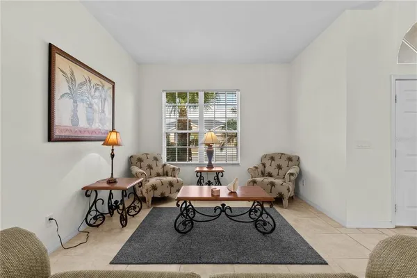 a living room with furniture a window and a table