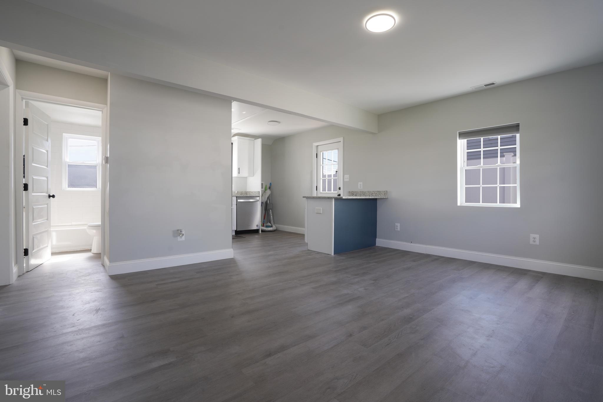 3112 Baybriar Road Dundalk, MD 21222 - Photo 20 of 20 an empty room with wooden floor and windows
