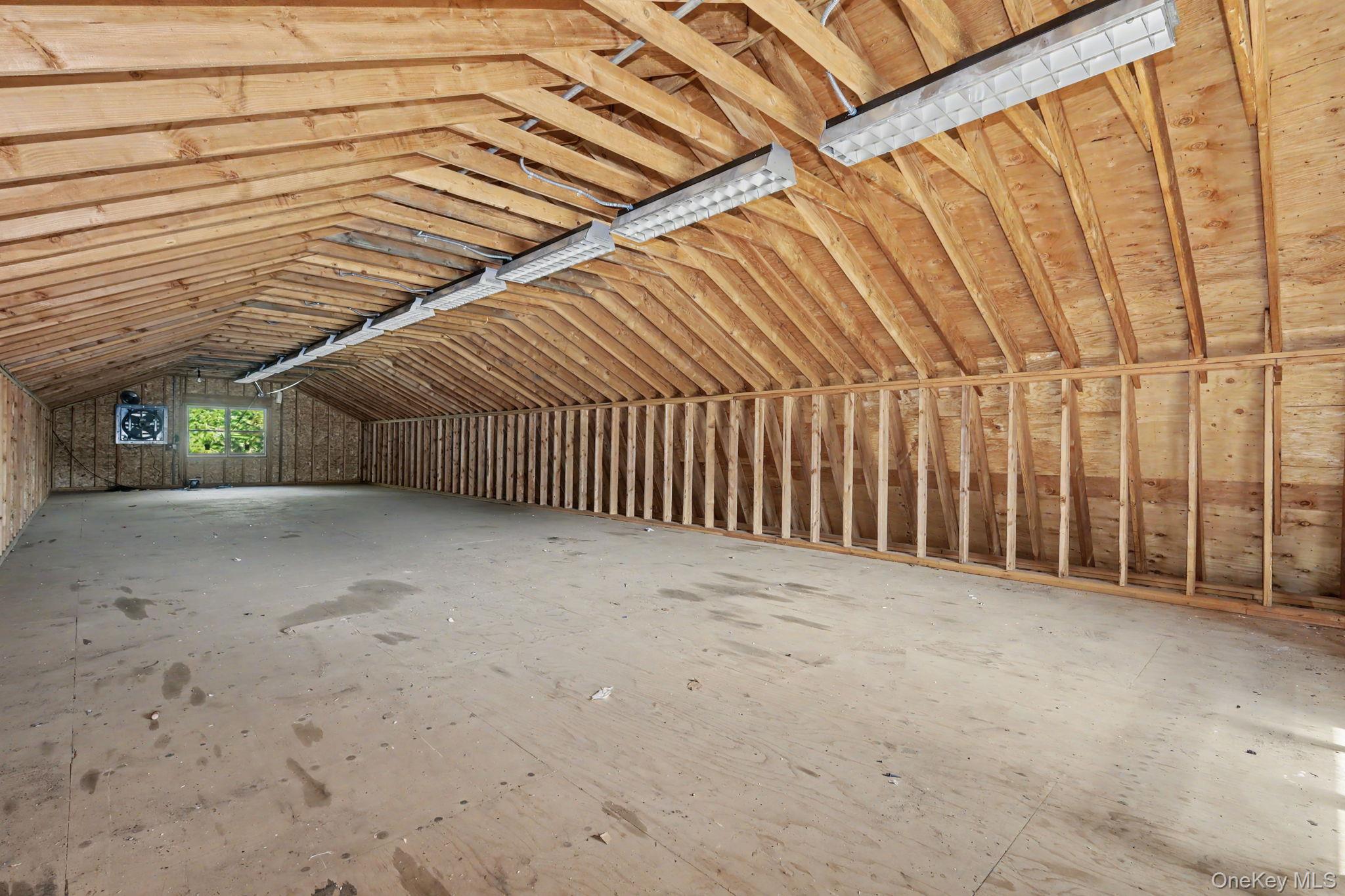 214 Starr Ridge Road Brewster, NY 10509 - Photo 34 of 37 staircase which leads to the large unfinished second story. Ideal for the car enthusiast, hobbyist, contractor, collector, or anyone looking for exceptional workspace, the barn is equipped with electrical, professional car lifts and offers plenty of room for multiple vehicles, equipment, tools, and storage.