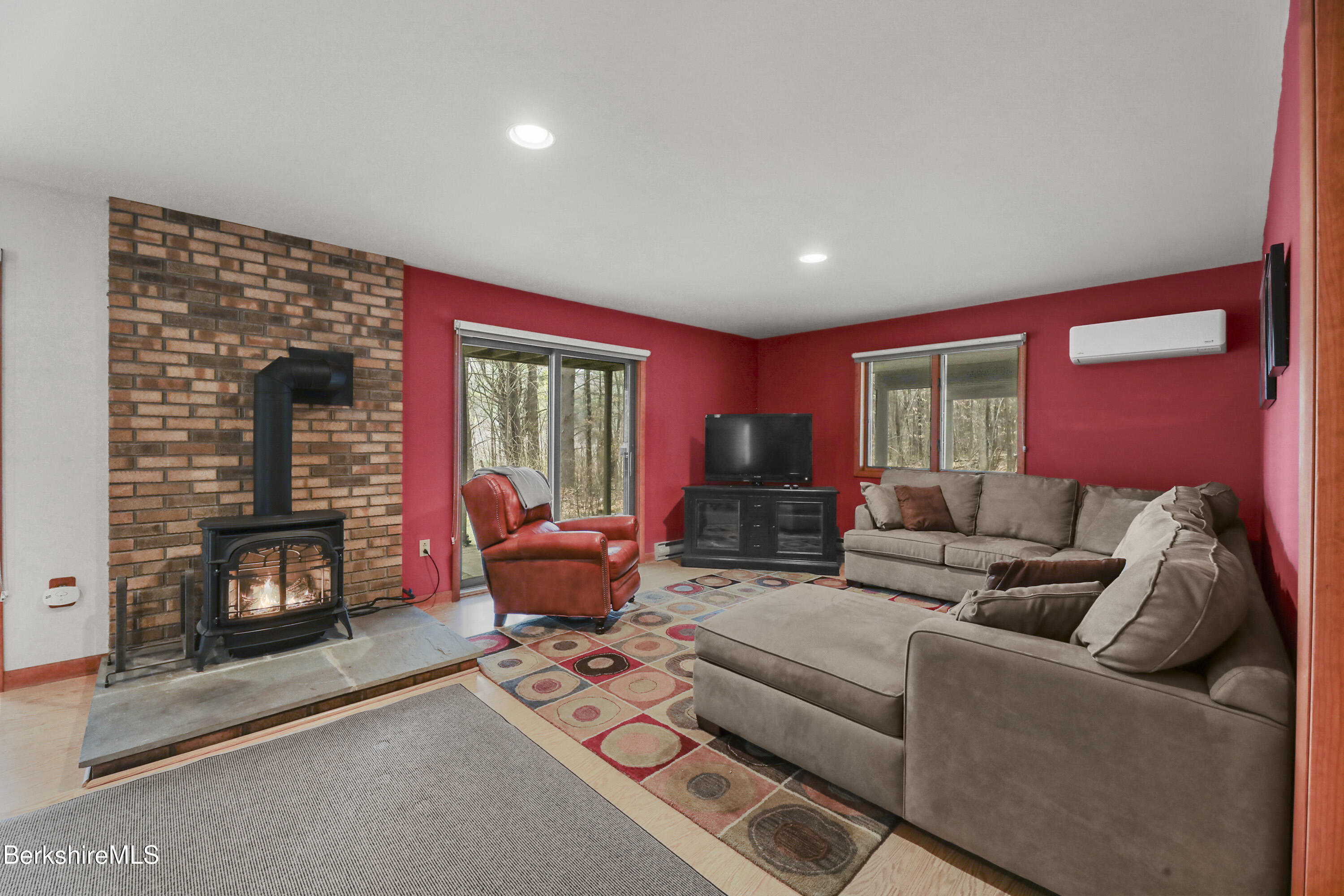 105 Harrington Road Otis, MA 01253 - Photo 48 of 68 a living room with furniture and a fireplace