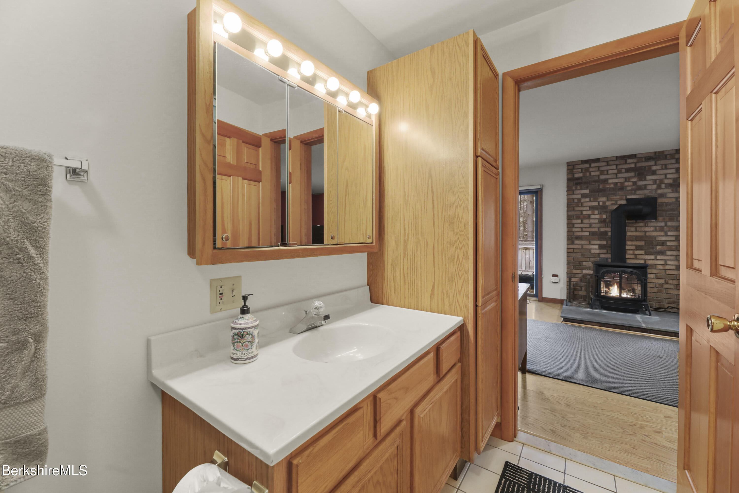 105 Harrington Road Otis, MA 01253 - Photo 54 of 68 a en suite bathroom with a sink and mirror