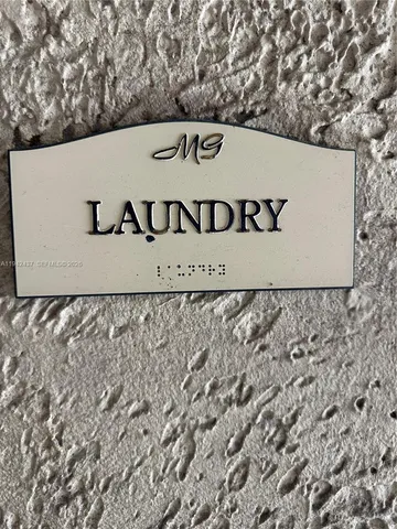 a room with a washing machine and sink