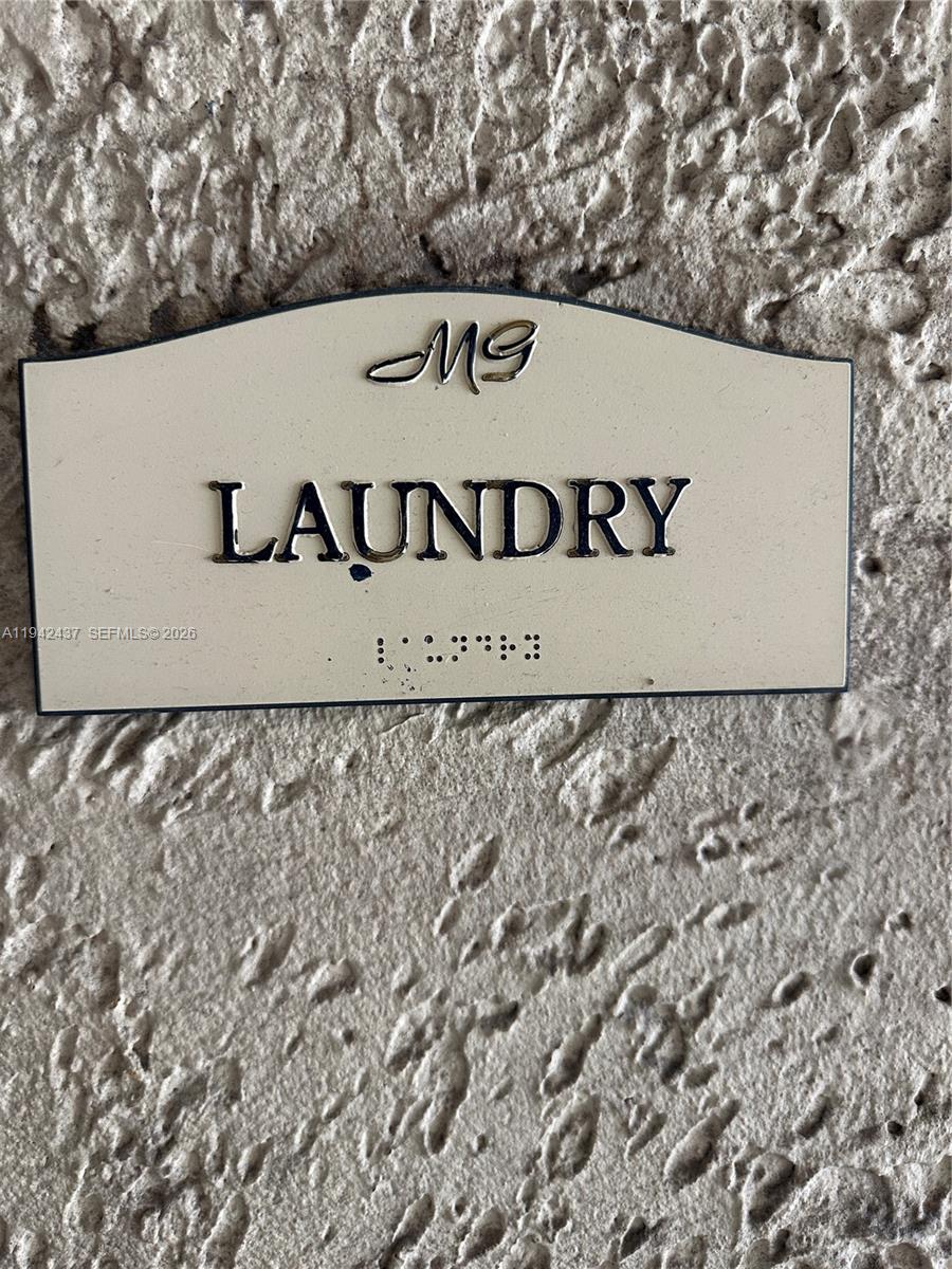 8605 Southwest 68th Court, Unit 26 Pinecrest, FL 33156 - Photo 15 of 21 a sign broad on the side of the road